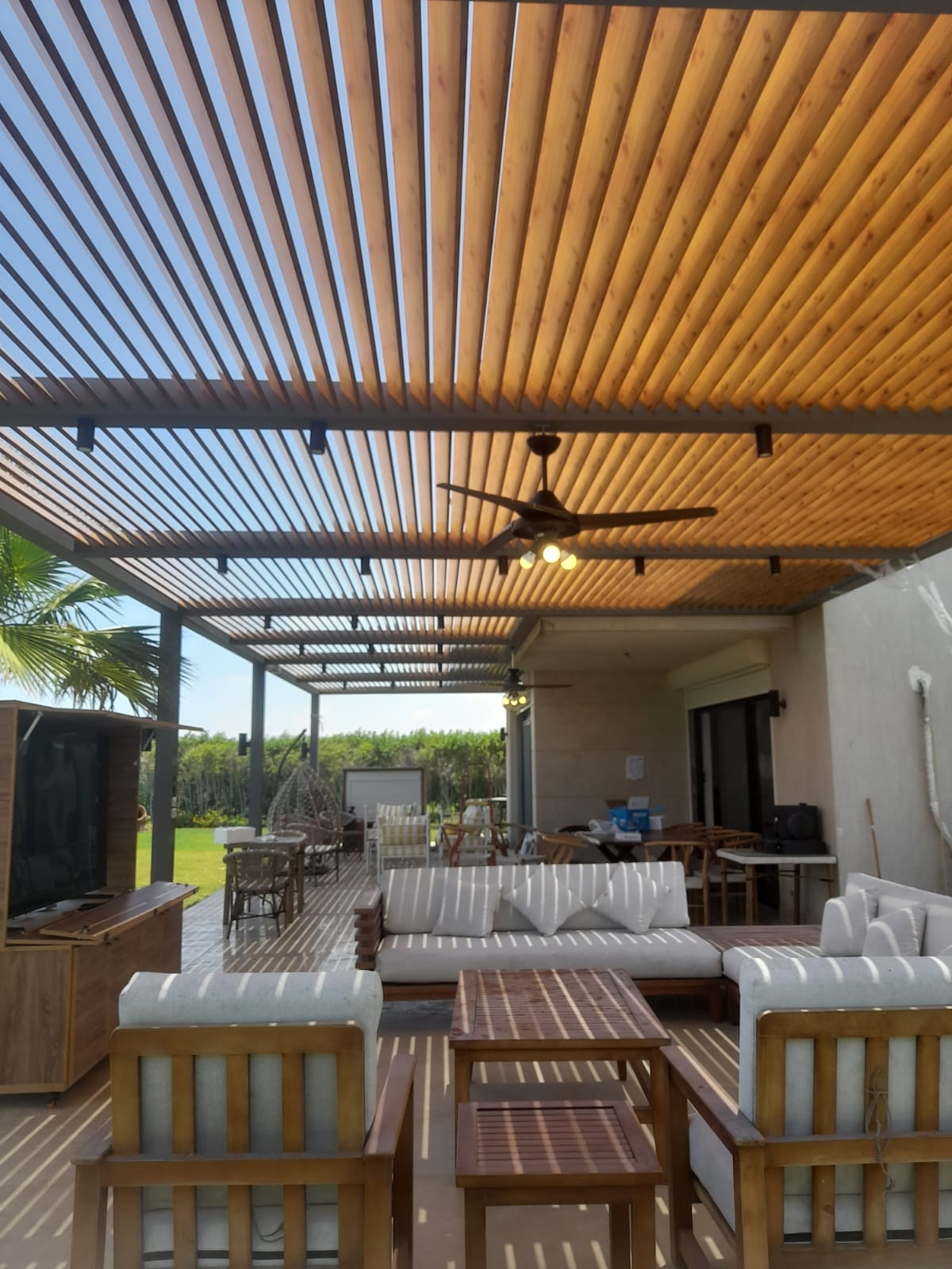 Wood-look aluminum pergola over a covered patio