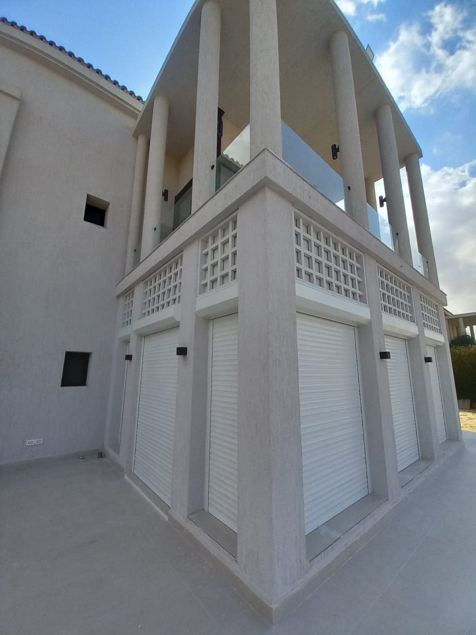 Roller shutters installed on a villa exterior
