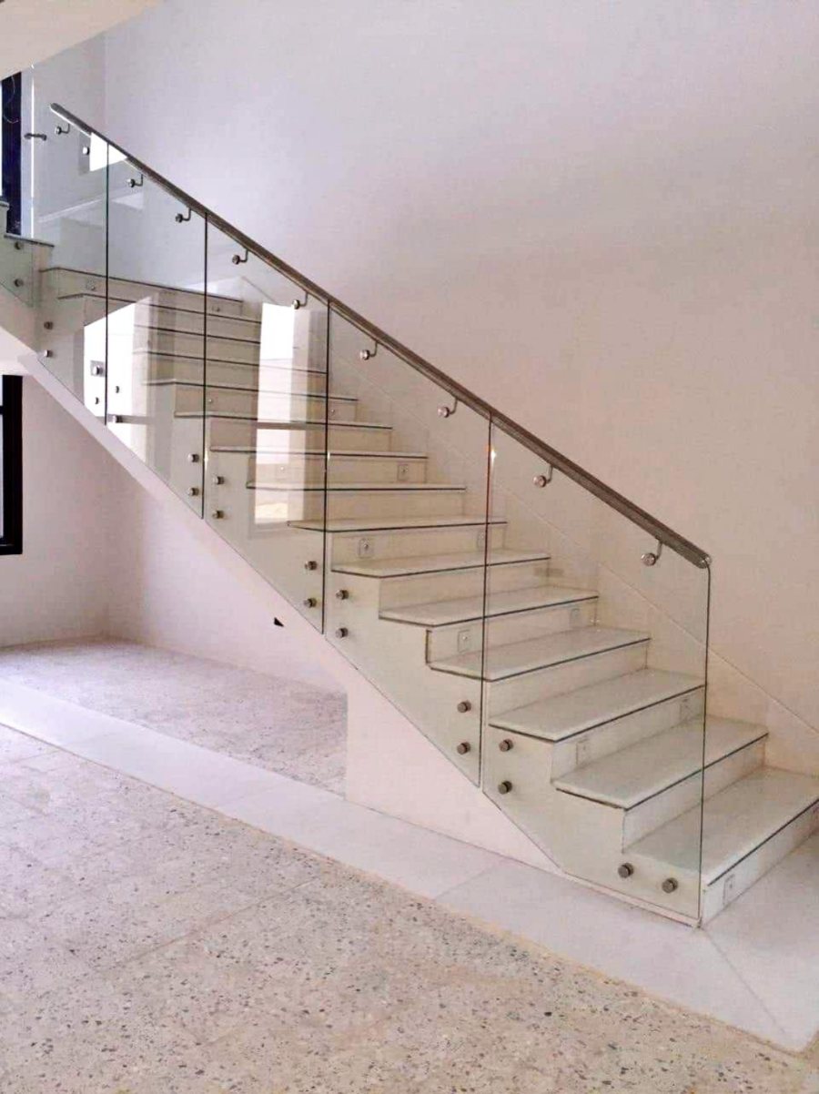 Glass railing on white staircase