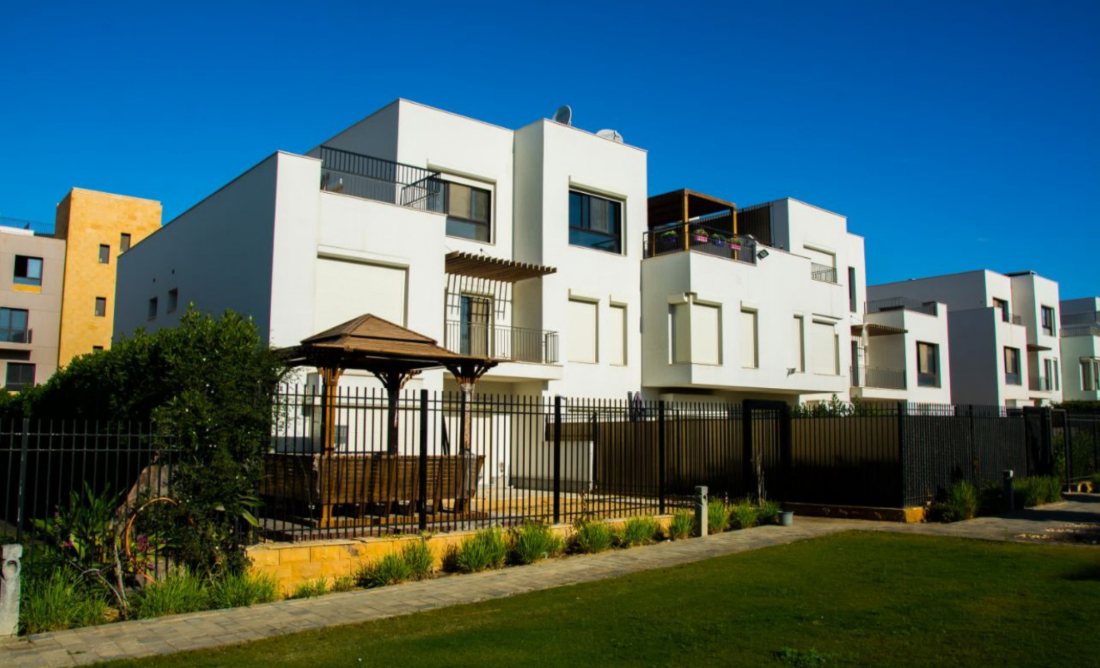 White roller shutters on a modern compound facade