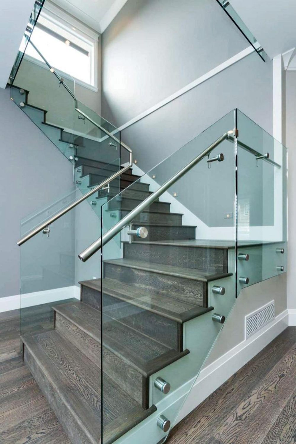 Frameless glass stair balustrade with stainless handrail